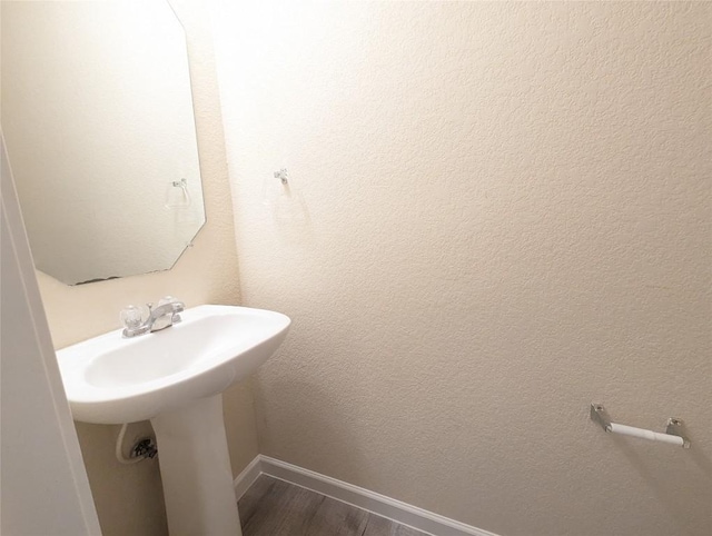 bathroom featuring wood-type flooring