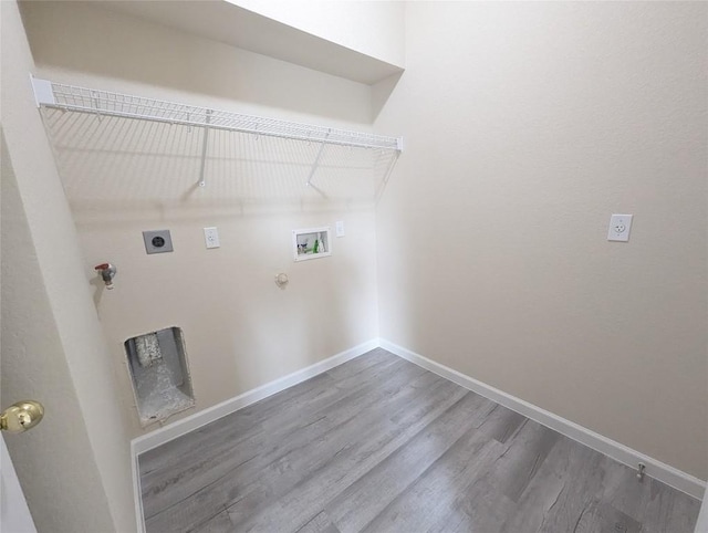 laundry area featuring gas dryer hookup, wood-type flooring, hookup for a washing machine, and electric dryer hookup