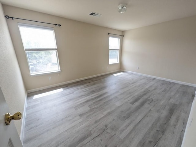 unfurnished room featuring light hardwood / wood-style flooring