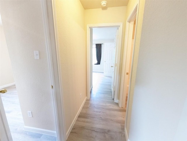 corridor featuring light wood-type flooring