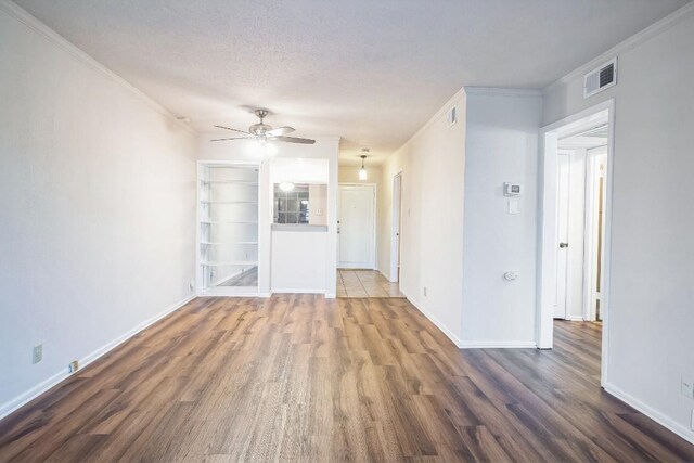 7920 Rockwood Ln Unit 202, Austin, TX 78757 - unfurnished living room featuring wood finished floors, ceiling fan, baseboards, and ornamental molding