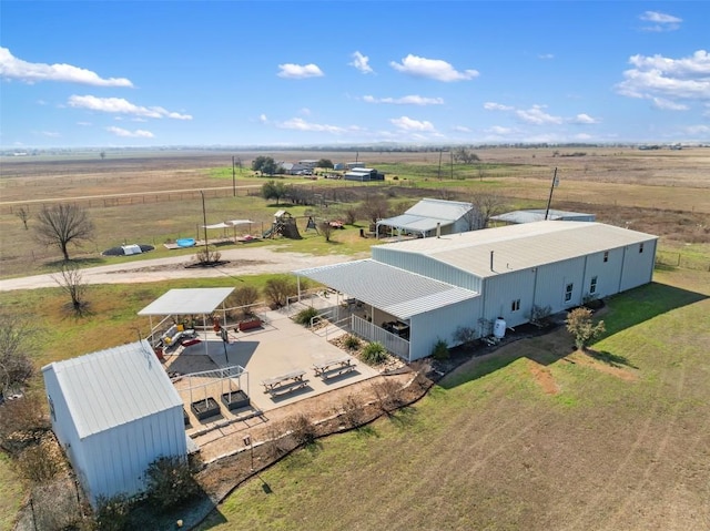 birds eye view of property featuring a rural view