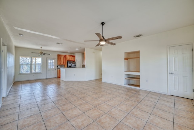 1504 Timber Valley Ln, Granite Shoals, TX 78654 - unfurnished living room featuring a ceiling fan, built in shelves, light tile patterned flooring, and recessed lighting