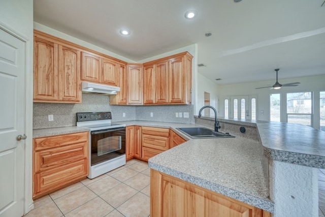 1504 Timber Valley Ln, Granite Shoals, TX 78654 - kitchen with white electric range, under cabinet range hood, light tile patterned flooring, a peninsula, and backsplash