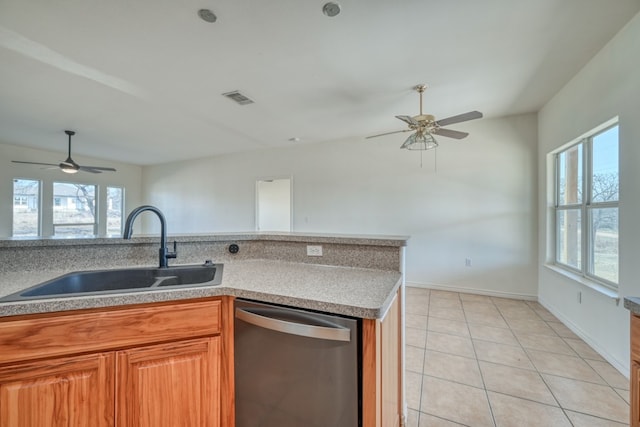 1504 Timber Valley Ln, Granite Shoals, TX 78654 - kitchen with stainless steel dishwasher, a ceiling fan, plenty of natural light, and light tile patterned floors