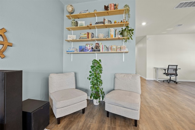 sitting room with hardwood / wood-style floors