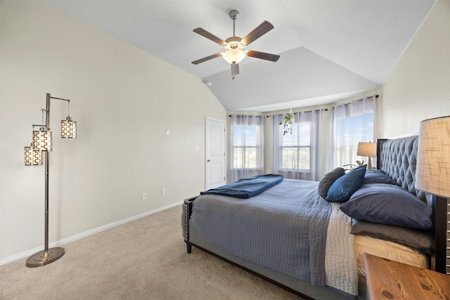 carpeted bedroom featuring ceiling fan and vaulted ceiling