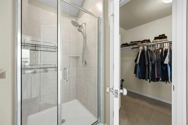 bathroom with a shower with door