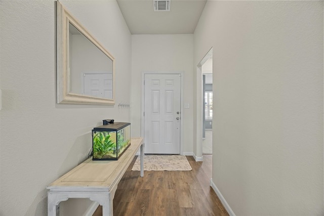 hall with dark hardwood / wood-style flooring