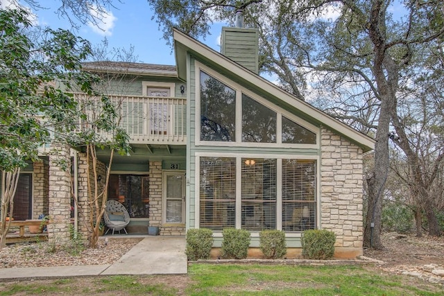 view of front of property with a balcony