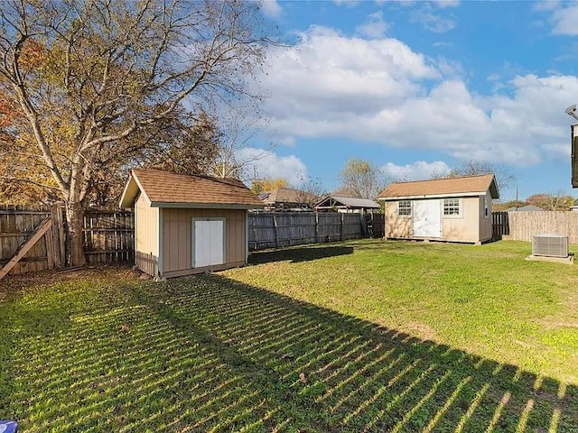 view of yard featuring a shed and cooling unit