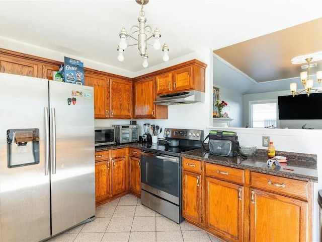 kitchen with pendant lighting, dark stone countertops, a chandelier, light tile patterned floors, and stainless steel appliances