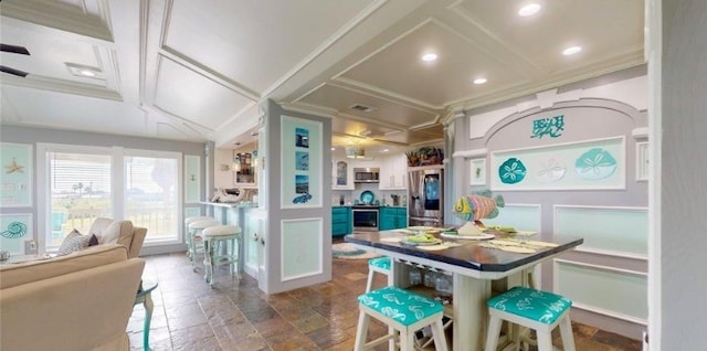 kitchen with coffered ceiling, a kitchen bar, stainless steel appliances, and a center island