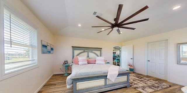 bedroom with ceiling fan and light wood-type flooring