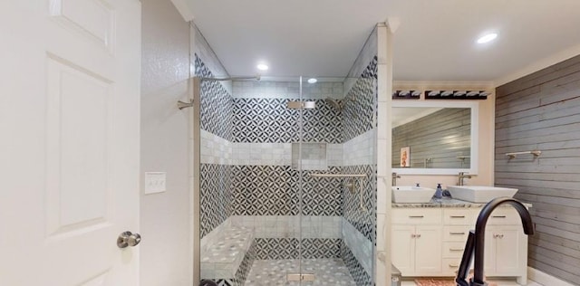 bathroom with vanity and tiled shower