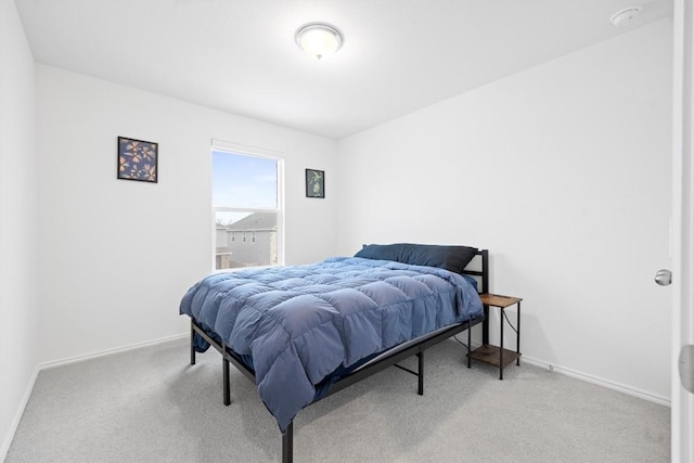 bedroom with light colored carpet