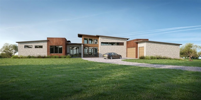 view of front of property featuring a garage and a front lawn