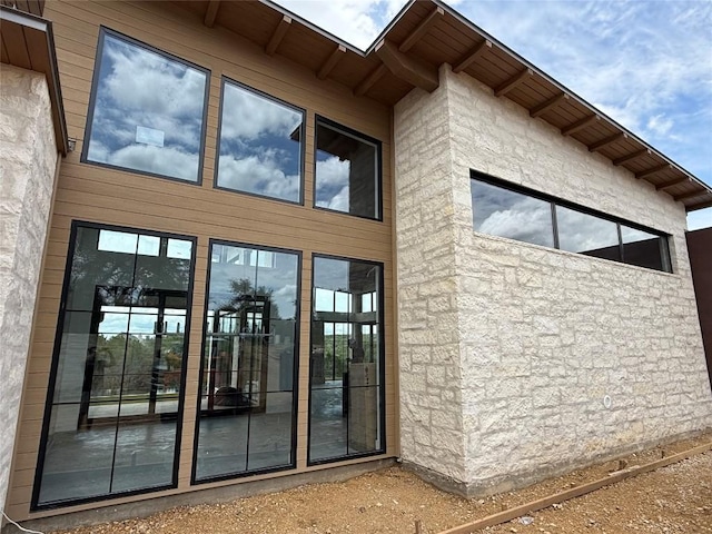 4600 Wild Cow Cv, Spicewood, TX 78669 - doorway to property with stone siding