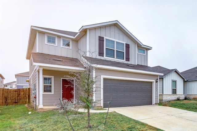 view of front of home with a garage and a front lawn