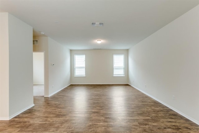 unfurnished room featuring dark hardwood / wood-style floors