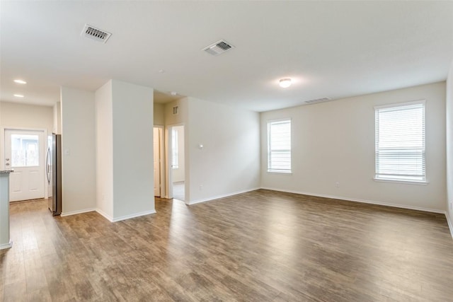 empty room with wood-type flooring