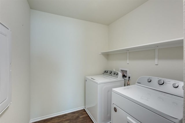 laundry area featuring dark wood-type flooring and washer and clothes dryer