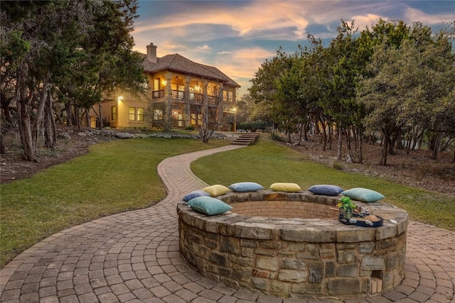 patio terrace at dusk with a yard