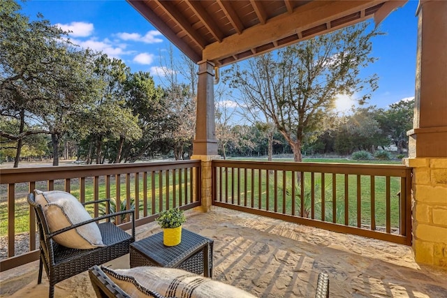 wooden terrace with a yard