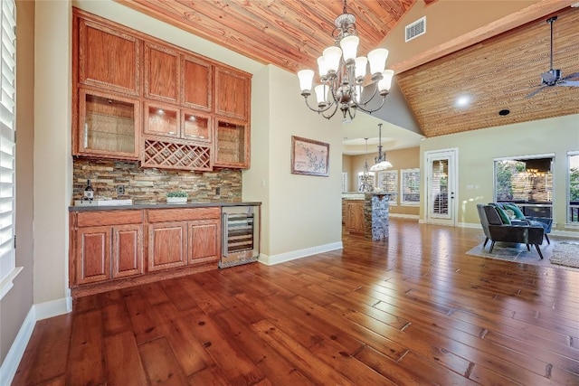 kitchen featuring wood ceiling, decorative light fixtures, high vaulted ceiling, dark hardwood / wood-style flooring, and beverage cooler