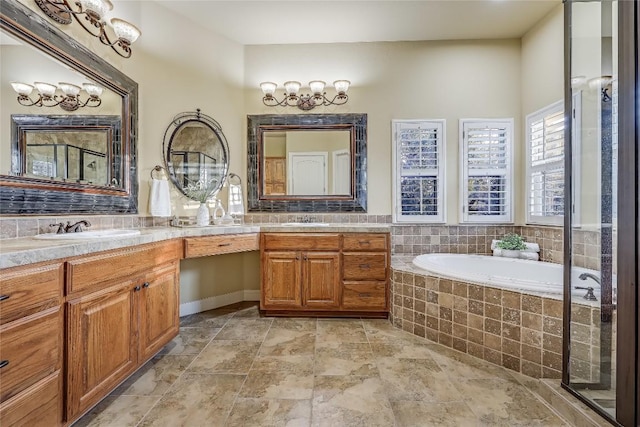 bathroom featuring a relaxing tiled tub and vanity