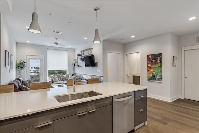 1800 E 4th St Unit 337, Austin, TX 78702 - kitchen featuring a sink, dishwasher, open floor plan, light countertops, and dark wood-style flooring