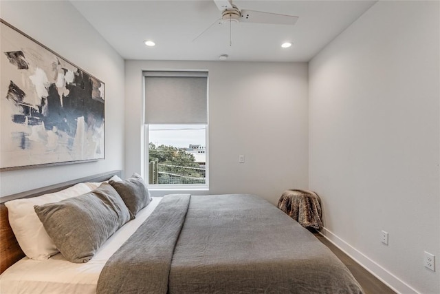1800 E 4th St Unit 337, Austin, TX 78702 - bedroom featuring wood finished floors, baseboards, recessed lighting, and a ceiling fan