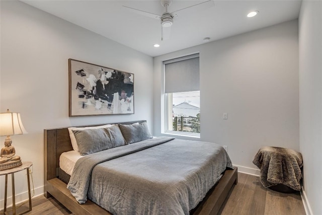 1800 E 4th St Unit 337, Austin, TX 78702 - bedroom with baseboards, wood finished floors, recessed lighting, and a ceiling fan