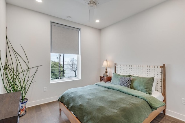 1800 E 4th St Unit 337, Austin, TX 78702 - bedroom with baseboards, wood finished floors, recessed lighting, and ceiling fan