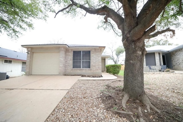 ranch-style house featuring central AC unit