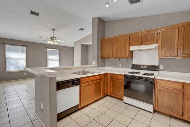 9145 Swanson Ln, Austin, TX 78748 - kitchen featuring white dishwasher, gas stove, a sink, lofted ceiling, and light tile patterned flooring
