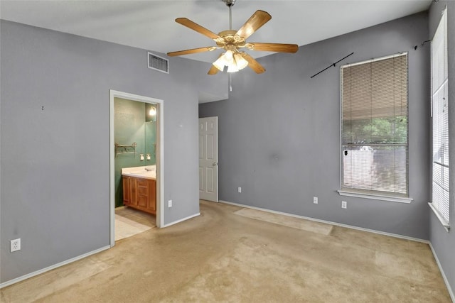 9145 Swanson Ln, Austin, TX 78748 - unfurnished bedroom featuring ceiling fan, visible vents, carpet floors, baseboards, and ensuite bath