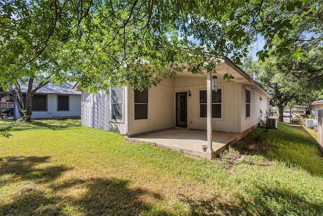 9145 Swanson Ln, Austin, TX 78748 - back of property featuring a yard, a patio, and central AC unit