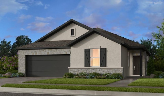 view of front of house featuring a garage and a lawn