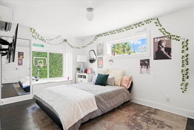 bedroom featuring dark hardwood / wood-style floors