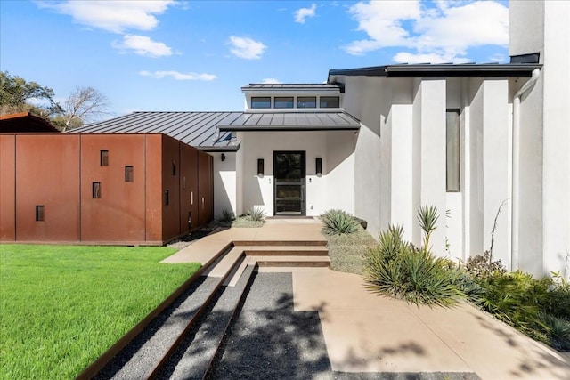 rear view of property with a yard and a patio area