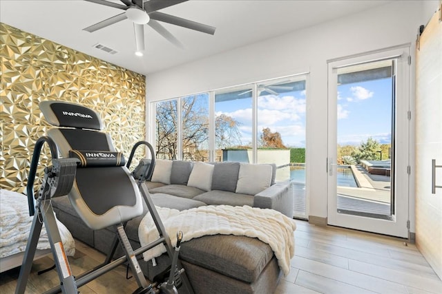 interior space with ceiling fan and light wood-type flooring