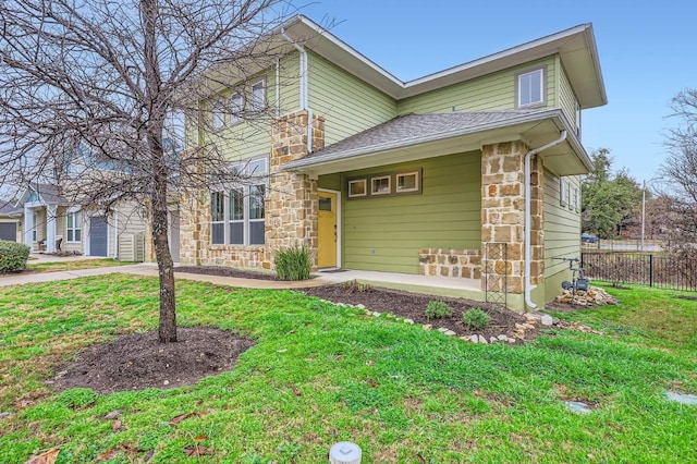 10610 Wills Loop, Austin, TX 78717 - view of front of house with stone siding, a garage, and a shingled roof
