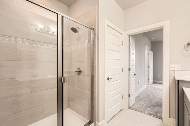 10610 Wills Loop, Austin, TX 78717 - bathroom featuring a shower stall, vanity, and tile patterned floors