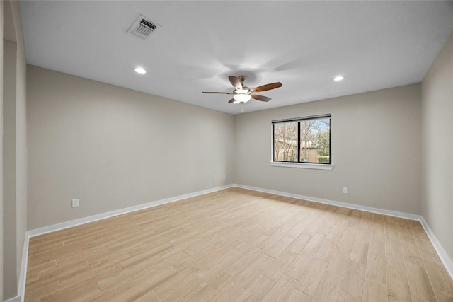 empty room featuring ceiling fan and light hardwood / wood-style floors