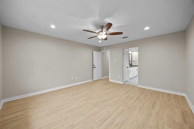 unfurnished room with ceiling fan and light hardwood / wood-style floors