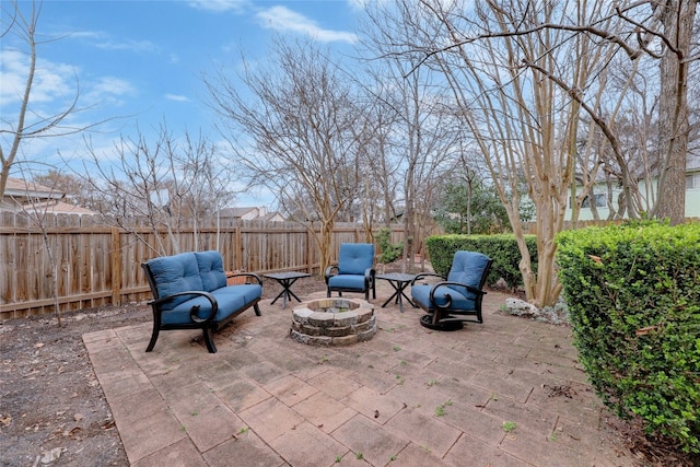 view of patio / terrace with an outdoor fire pit