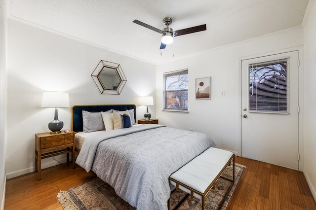 5608 Cougar Dr Unit 220, Austin, TX 78745 - bedroom with crown molding, wood finished floors, baseboards, and ceiling fan