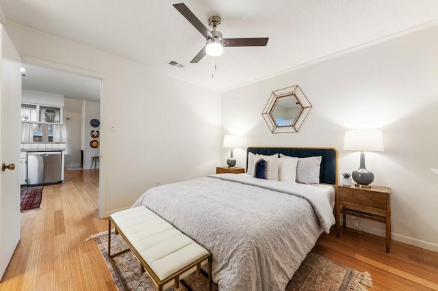 5608 Cougar Dr Unit 220, Austin, TX 78745 - bedroom with light wood-style flooring, baseboards, crown molding, and ceiling fan