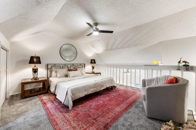 5608 Cougar Dr Unit 220, Austin, TX 78745 - bedroom with vaulted ceiling, carpet flooring, a textured ceiling, ceiling fan, and baseboards